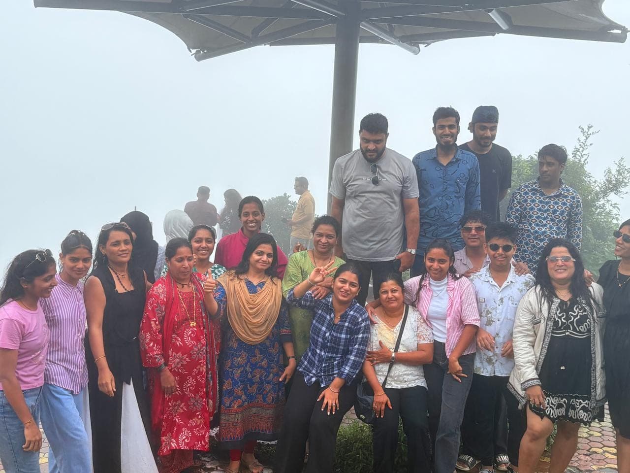 Thumbs up from the whole group under the viewpoint canopy